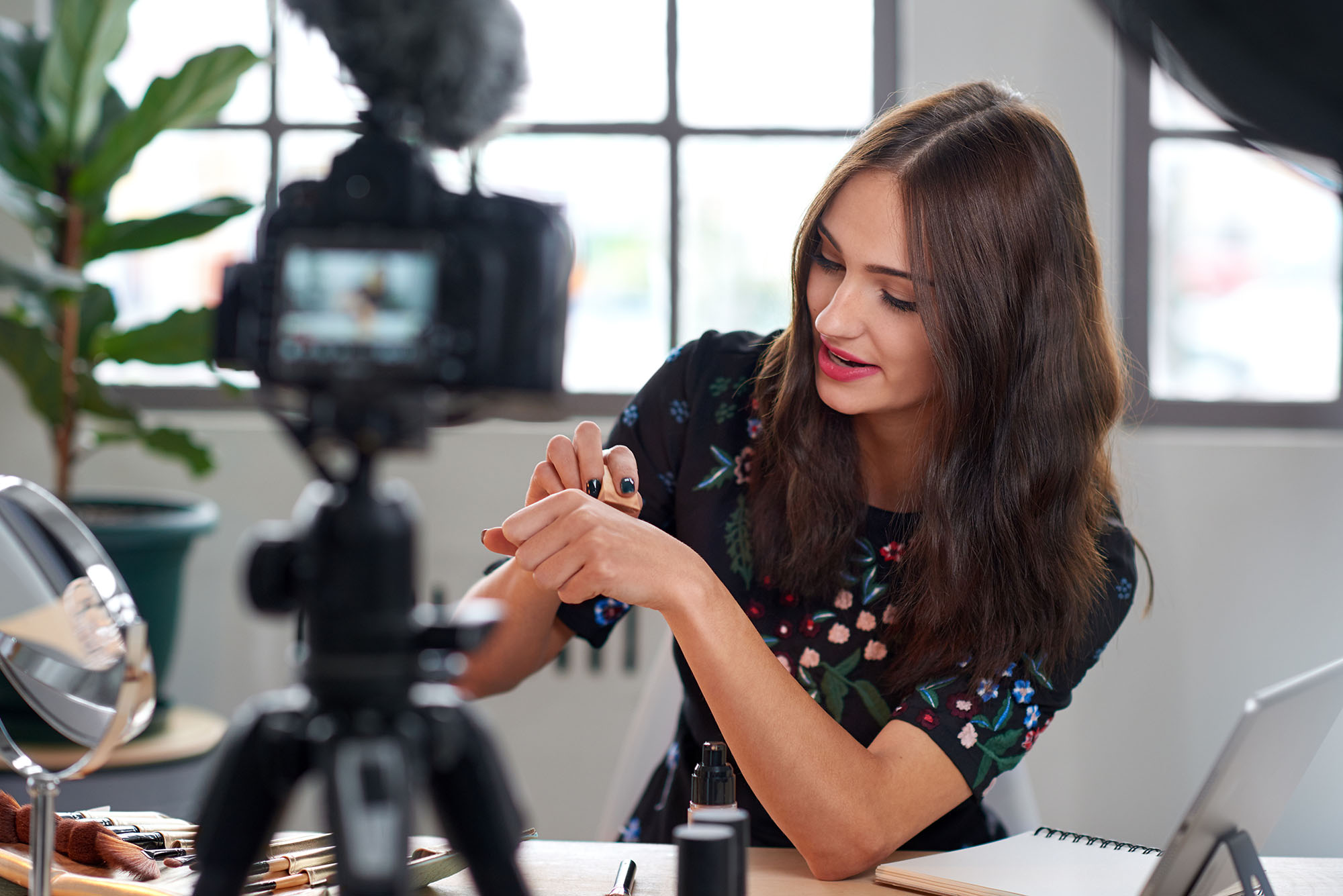 Beauty influencer recording content for online vlog, modern occupation profession job
